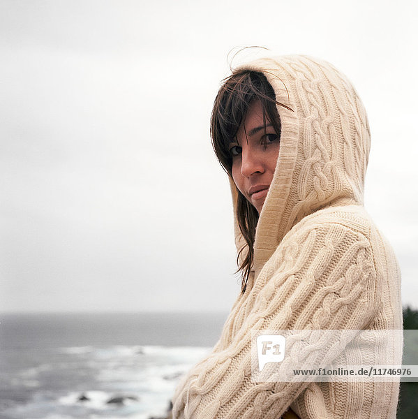 Portrait of woman in hooded sweater  Big Sur  California  USA
