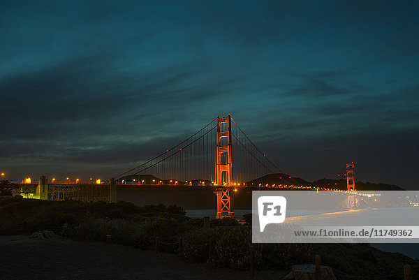 View of floodlit Golden Gate Bridge at night  San Francisco  California  USA