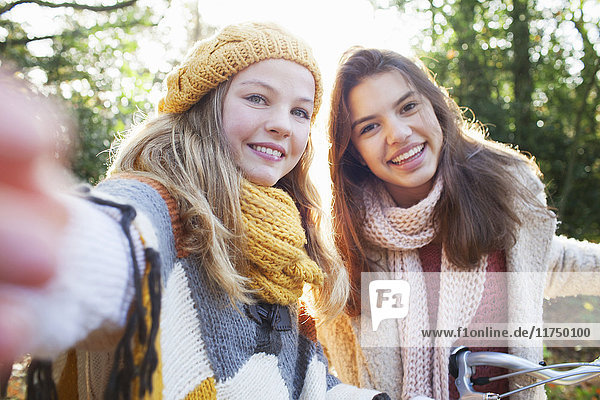 Portrait of teenage girls looking at camera smiling