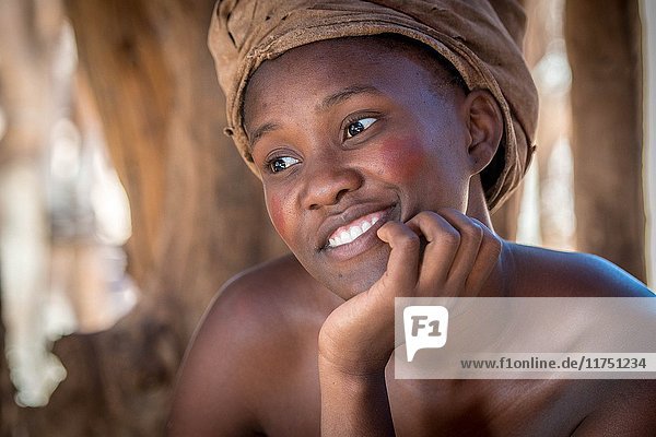 Damara woman poses for a photograph at theDamara Living Museum  located north of Twyfelfontein in Namibia  Africa.