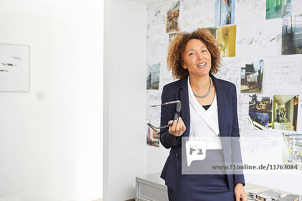 Portrait of mature female architect in office