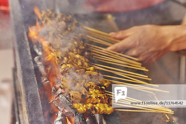 Detail  chicken satay cooked at street market  Chinatown  Malacca  Malaysia  Southeast Asia  Asia