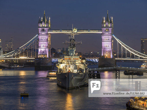 Tower Bridge and HMS Belfast on the River Thames at dusk  London  England  United Kingdom  Europe