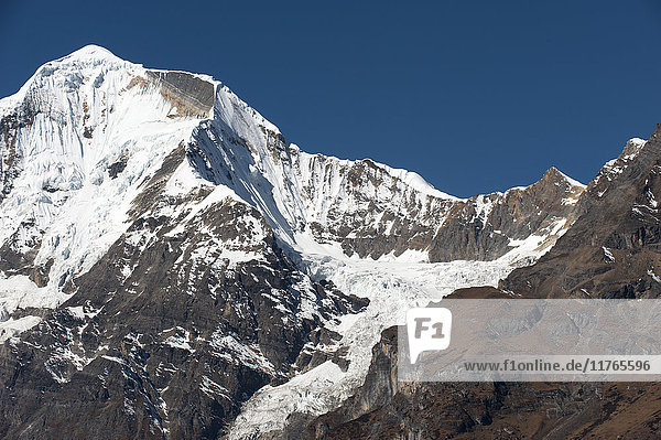 The looming face of Jomolhari third highest mountain in Bhutan at 7326m seen from Jangothang Thimpu District Bhutan Himalayas Asia