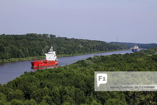 Freight Ships on Kiel Canal going near Hochdonn  Dithmarschen  Schleswig-Holstein  Germany  Europe