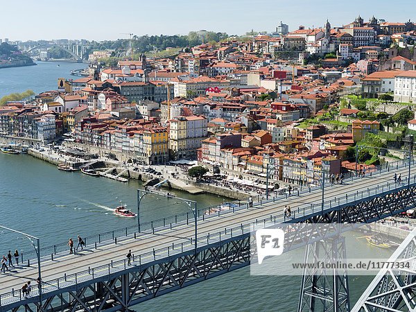 View from Vila Nova de Gaia towards Porto with the old town and the bridge Ponte Dom Luis I. City Porto (Oporto) at Rio Douro in the north of Portugal. The old town is listed as UNESCO world heritage. Europe  southern Europe  Portugal  April.