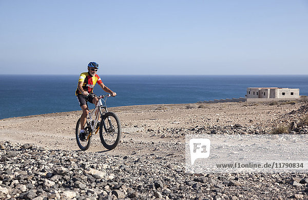 Spain  Canary Islands  Fuerteventura  senior man on mountainbike
