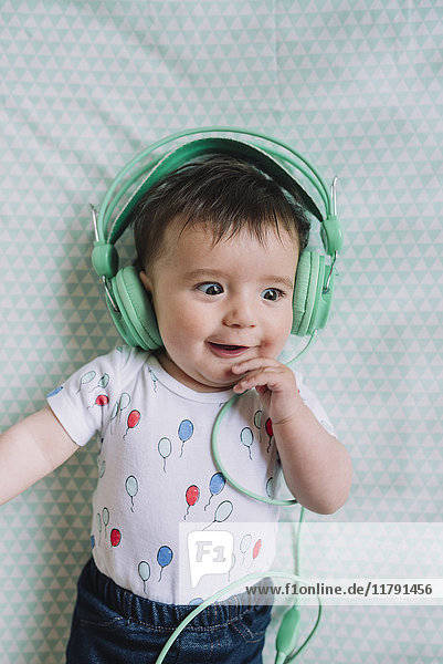 Portrait of baby girl with headphones