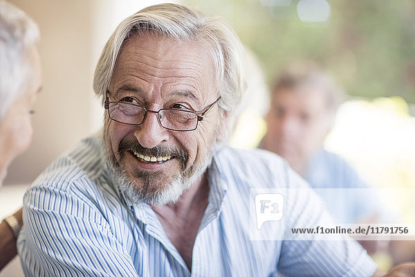 Portrait of smiling senior man wearing glasses