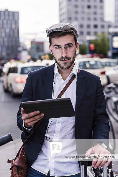 Young man in the city with tablet