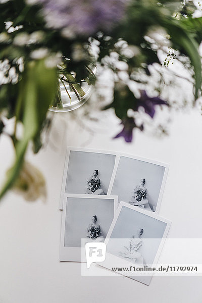 Flowers and instant photos of young woman