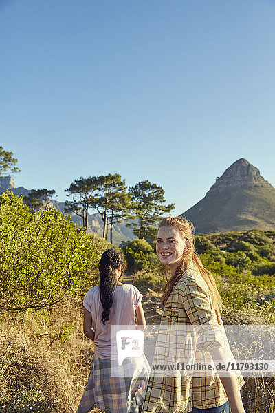 South Africa  Cape Town  Signal Hill  two young women hiking