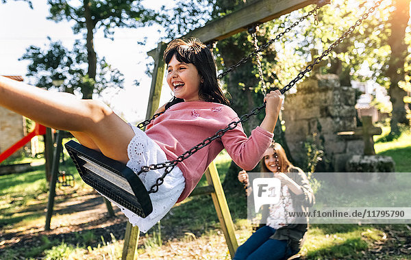 Three happy girls on a playground