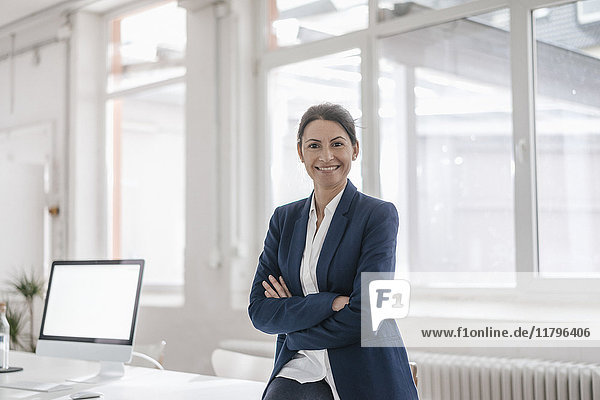 Portrait of smiling businesswoman in an office
