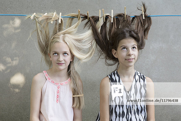Girls hair drying on clothesline