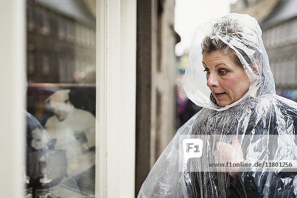 Woman wearing rain poncho