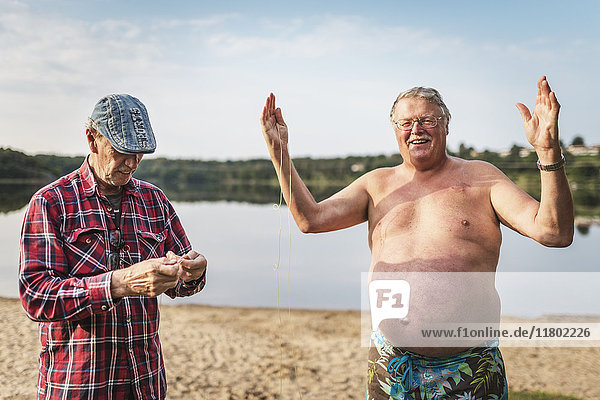 Senior men at lake