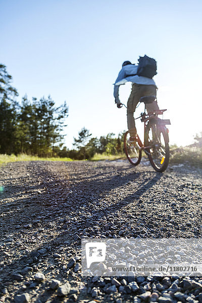 Man on bike in rural area