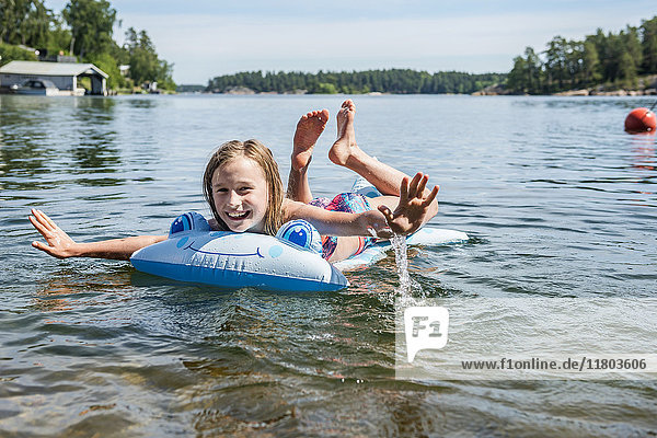 Happy girl on inflatable raft