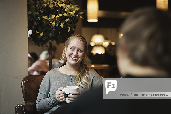 Smiling woman in cafe