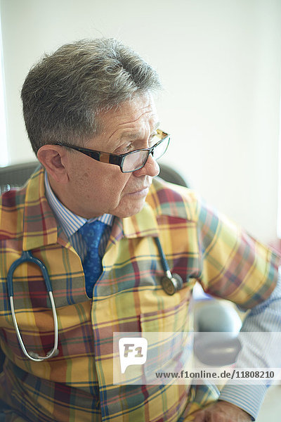 Hispanic doctor looking away