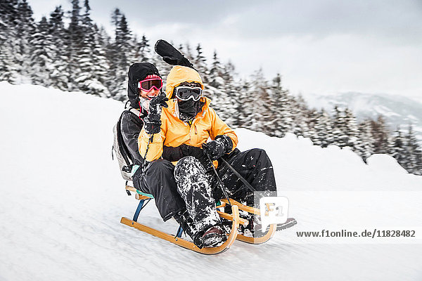 Young couple sledging  Bramberg am Wildkogel  Austria