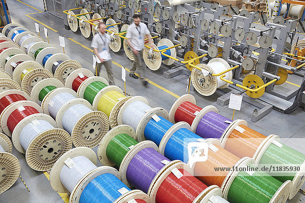 Elevated view multicolor spools in fiber optics factory