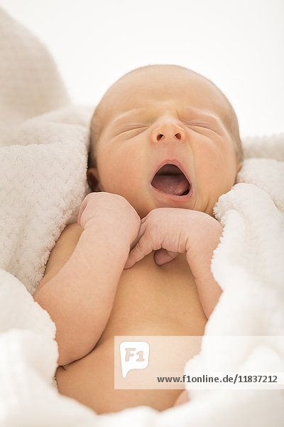 Newborn boy (0-1 month) yawning
