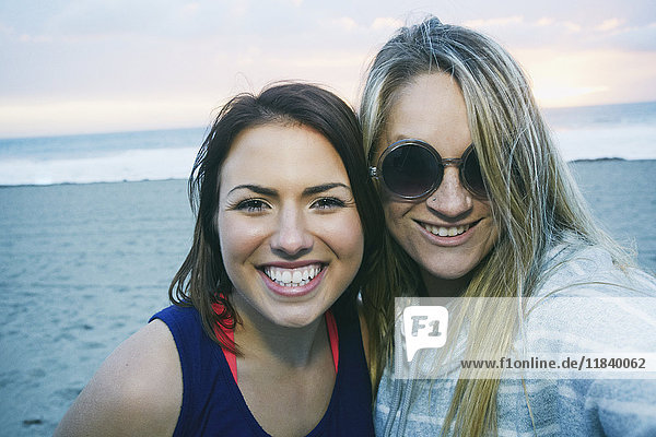 Portrait of smiling Caucasian women at beach