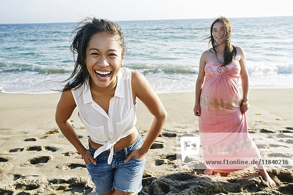 Women laughing on beach