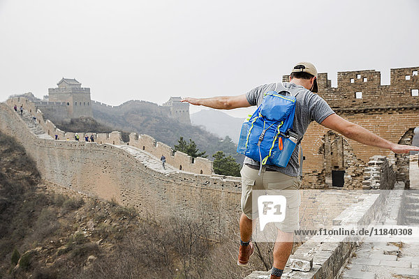 Tourist balancing on Great Wall of China  Beijing  China