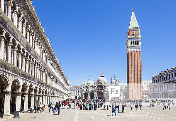 Campanile tower  Piazza San Marco (St. Marks Square) with tourists and Basilica di San Marco  Venice  UNESCO World Heritage Site  Veneto  Italy  Europe