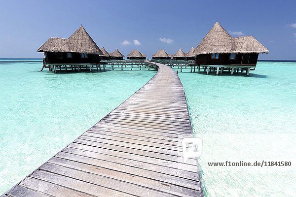 Over-water villas crystal clear sea and blue sky Coco Palm Dhuni Kolhu Baa Atoll Republic of Maldives Indian Ocean Asia
