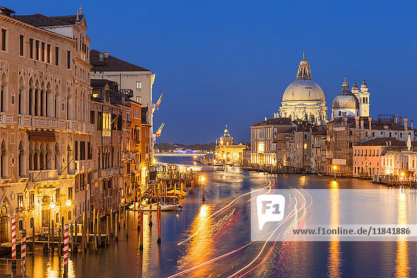 Grand Canal  and the church of Santa Maria della Salute  at night  with boat light trails  Venice  UNESCO World Heritage Site  Veneto  Italy  Europe
