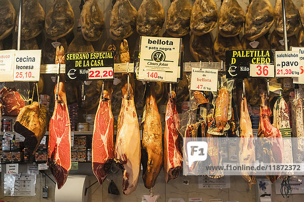 'Delicatessen shop in Madrid's downtown some delicious spanish hams; Madrid Spain'