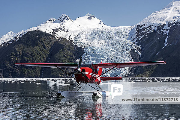 'Cessna 206 floatplane; Coxe Glacier in Barry Arm of Prince William Sound; Southcentral Alaska; tidewater glacier'