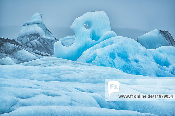 The large icebergs of Jokulsarlon  a glacial lagoon along the south coast of Iceland. The moody weather really brings out the blue ice; Iceland