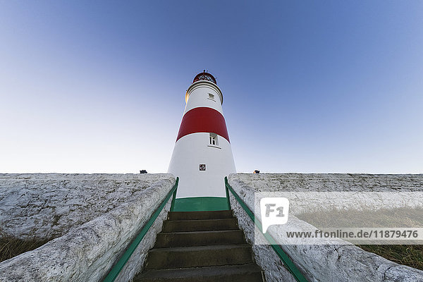 'Low angle view of steps leading to a lighthouse against a blue sky; South Shields  Tyne and Wear  England'