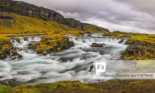 'Glacial river along the road on the south coast of Iceland; Iceland'