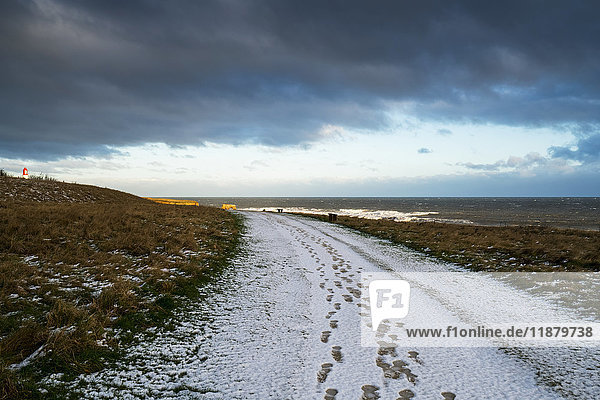 Footprints in the snow down a trail leading to the horizon; South Shields  Tyne and Wear  England