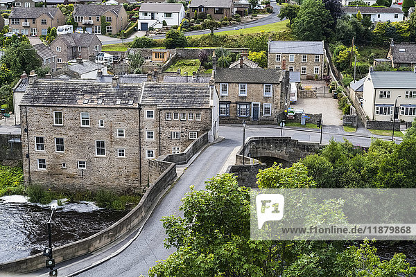 A street crossing a river and residential buildings; Barnard Castle  Durham  England