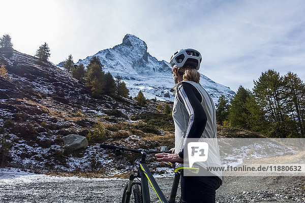 'Mountain biking near Zermatt  with a view of the Matterhorn; Valais  Switzerland'