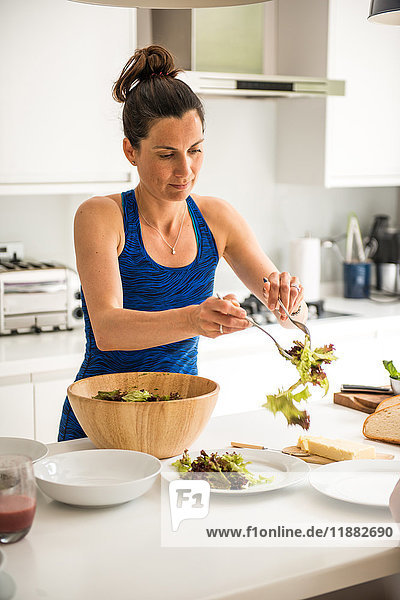 Woman preparing salad lunch
