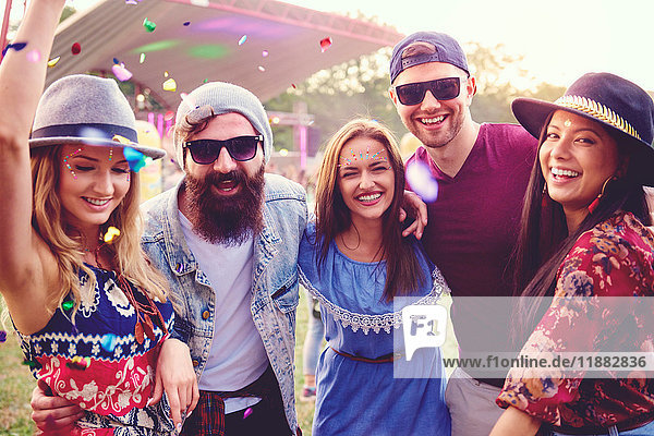 Portrait of young adult friends having fun at festival