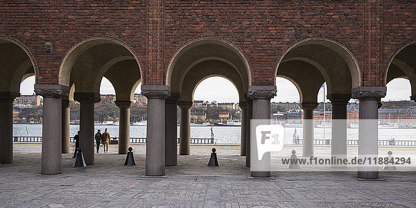 'A brick wall with arches and pillars  Stockholm City Hall; Stockholm  Sweden'