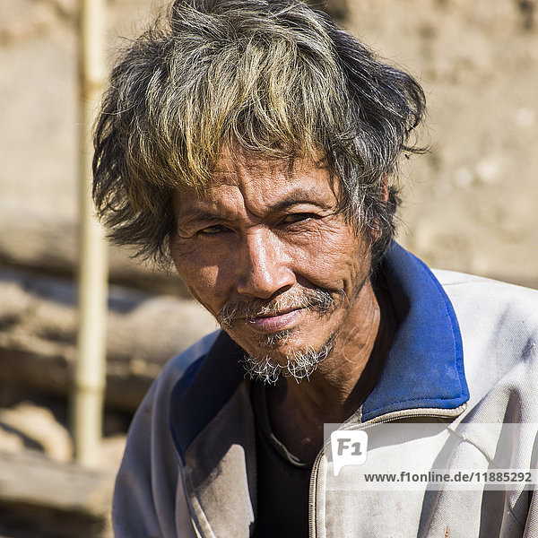 'Portrait of a Thai man with disheveled hair; Tambon Po  Chang Wat Chiang Rai  Thailand'