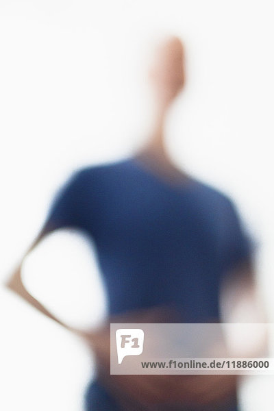 Defocused image of person wearing blue t-shirt