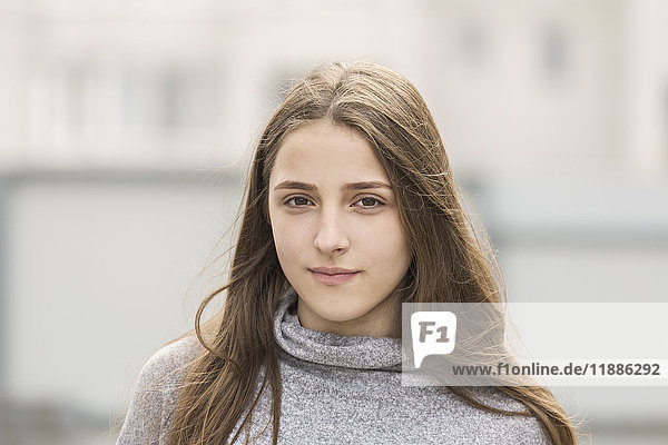Portrait of teenage girl with long brown hair