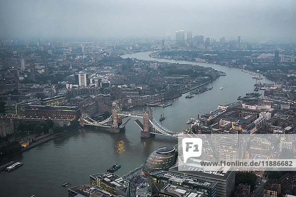 View of River Thames towards Canary Wharf,  open Tower Bridge with London City Hall,  twilight,  aerial view,  London,  England,  United Kingdom,  Europe