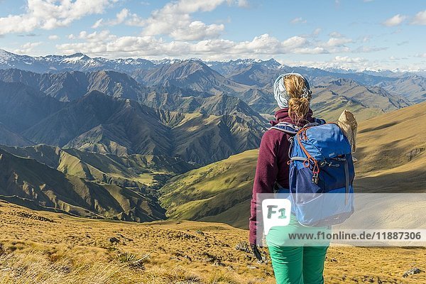 Female hiker enjoying view  view of Southern Alps  Ben Lomond  Otago  New Zealand  Oceania